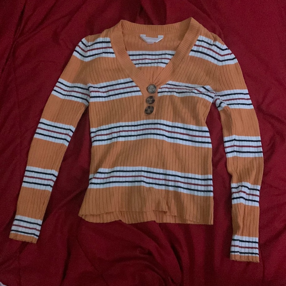 It’s a v neck long sleeve sweater